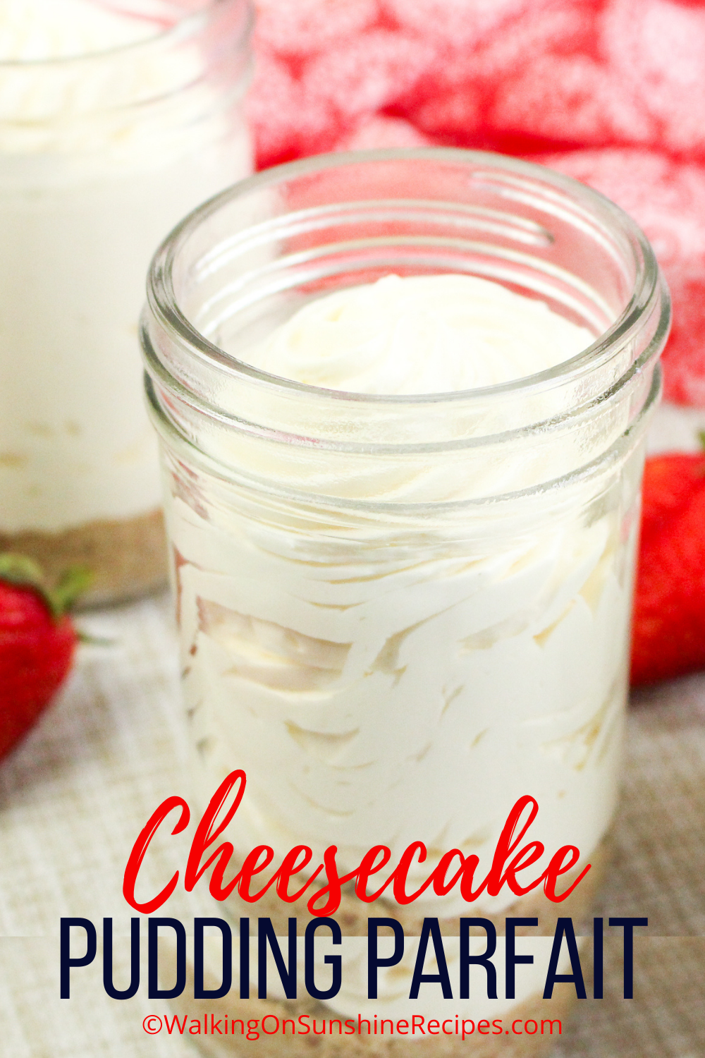 Cheesecake Pudding Parfait in mason jar with strawberry.