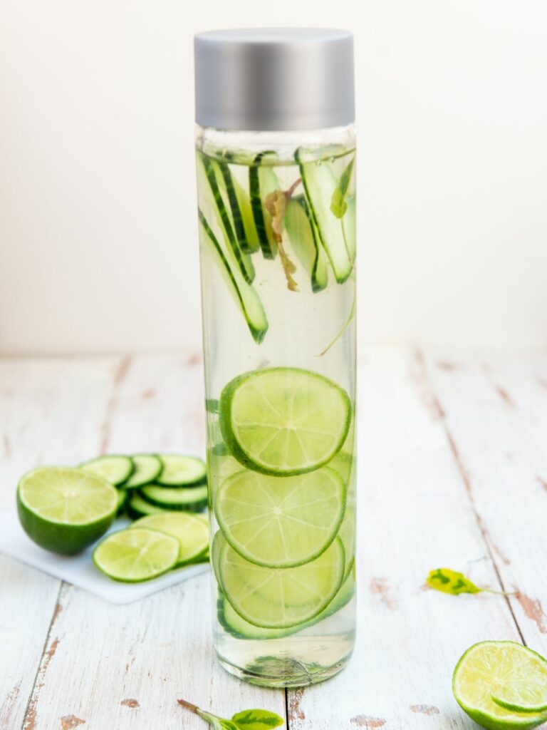 Infusion water bottle with fresh lime slices. 