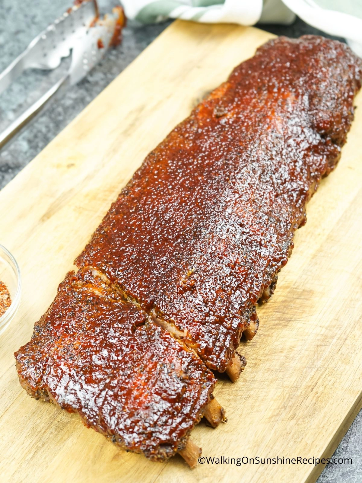 Oven baked ribs on cutting board