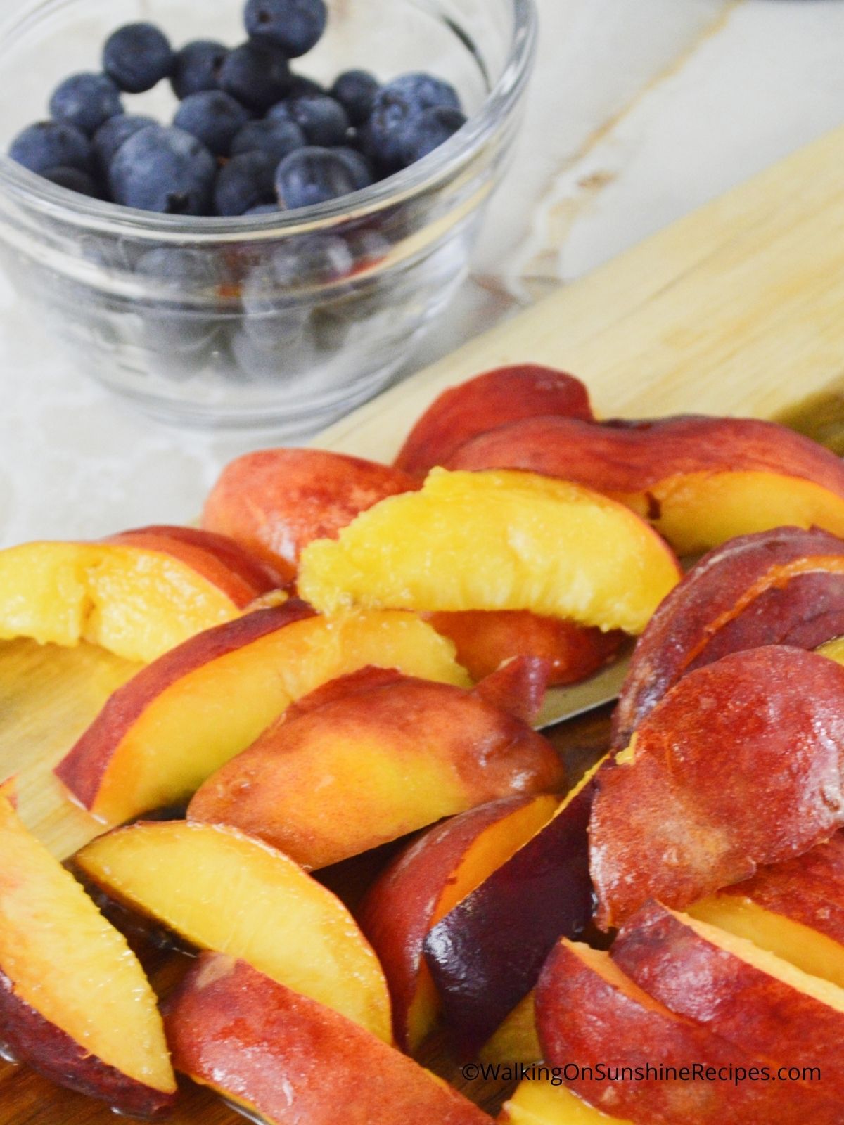 Sliced peaches and blueberries. 
