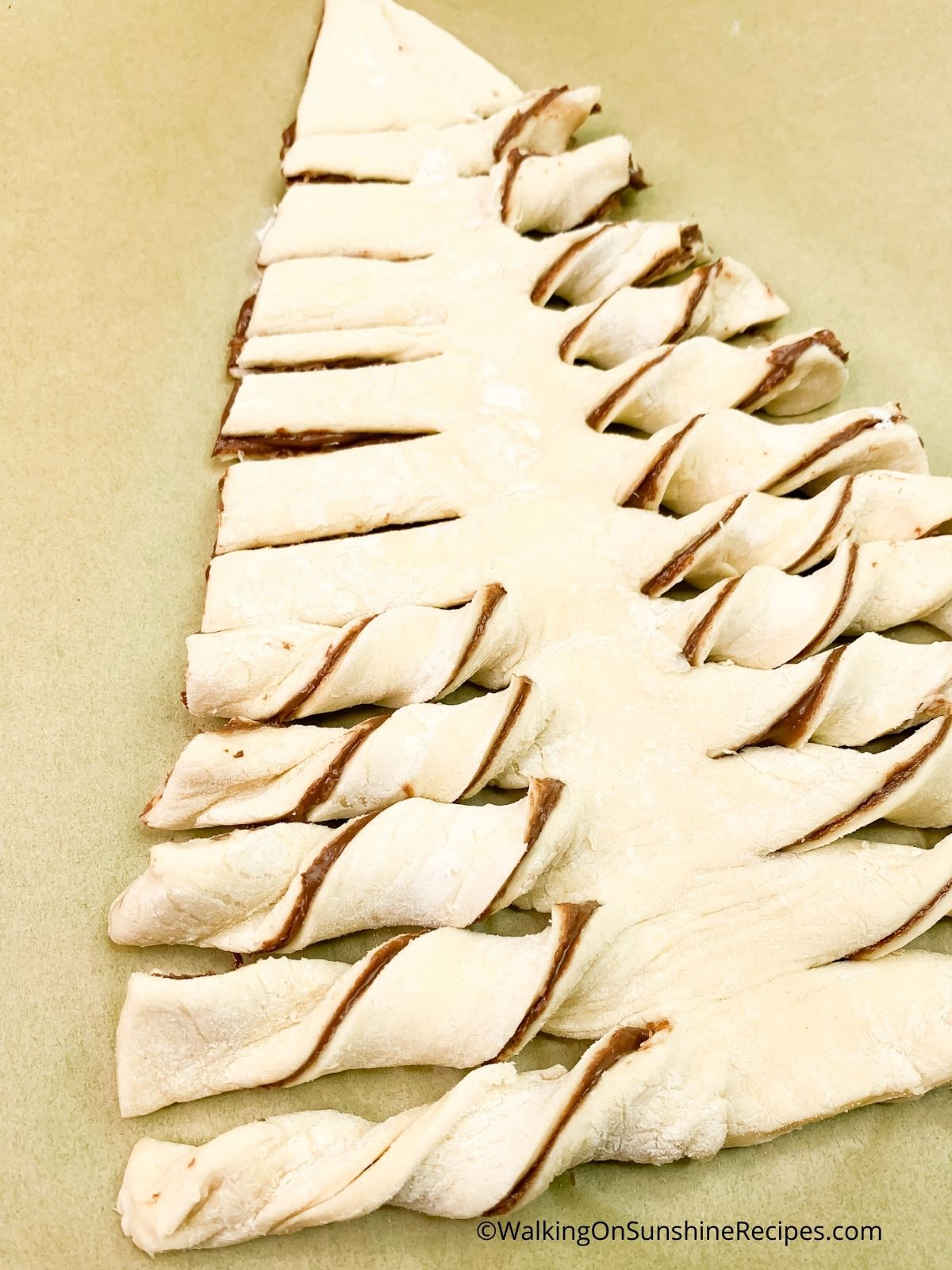 Twist Nutella puff pastry xmas tree branches.