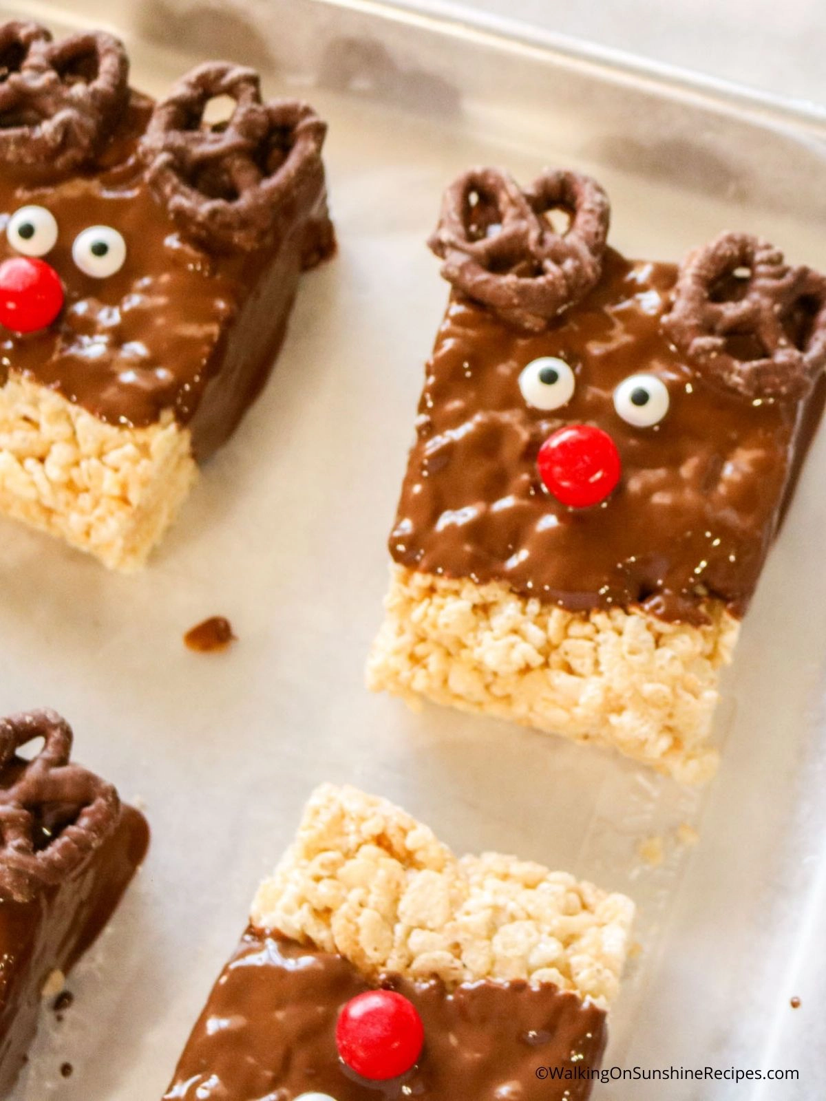 Reindeer treats dipped in melted chocolate with pretzel ears.
