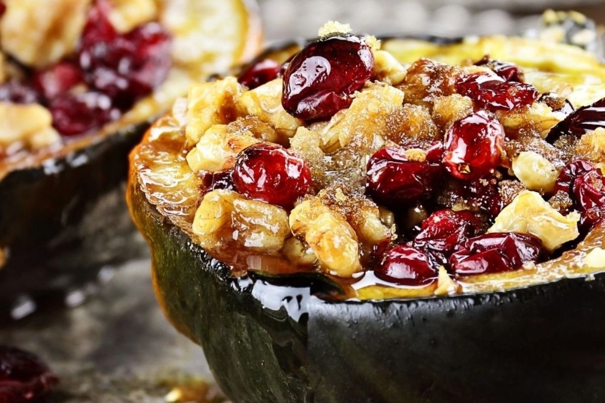 Roasted acorn squash halves on a tray.