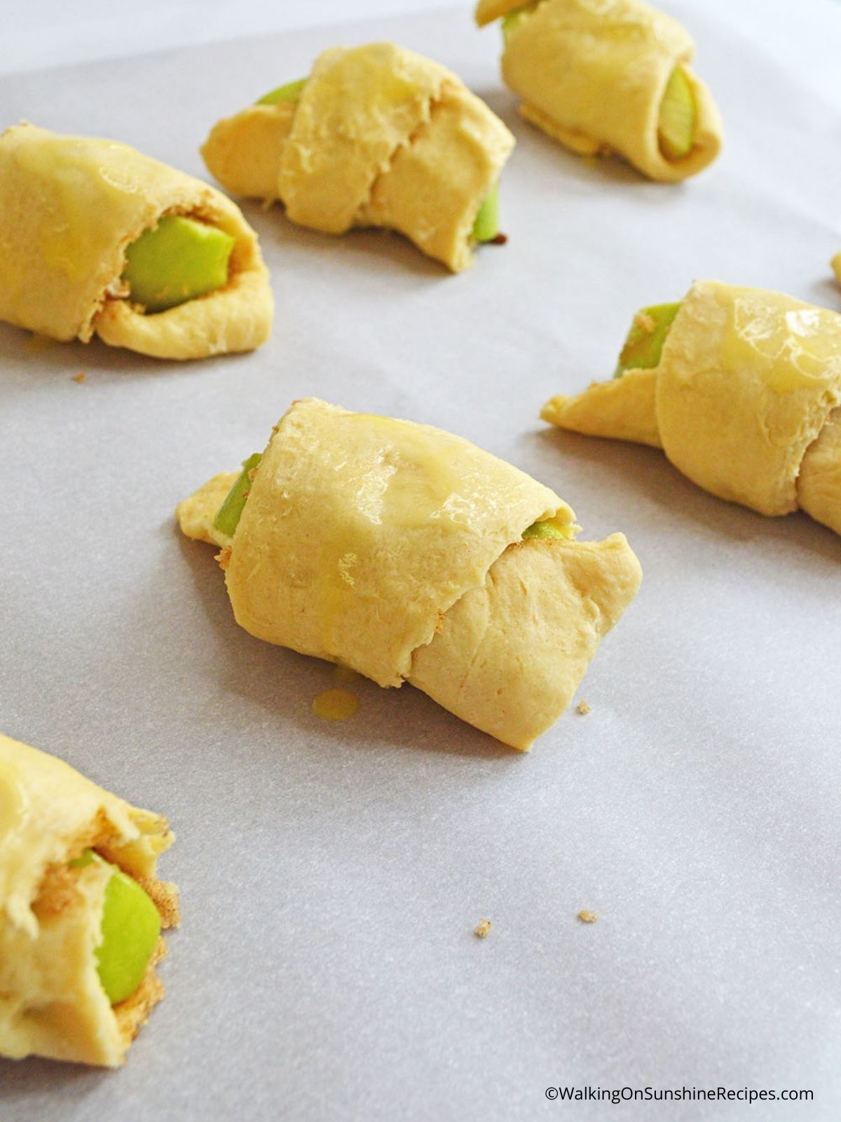 Roll up apple crescent rolls.