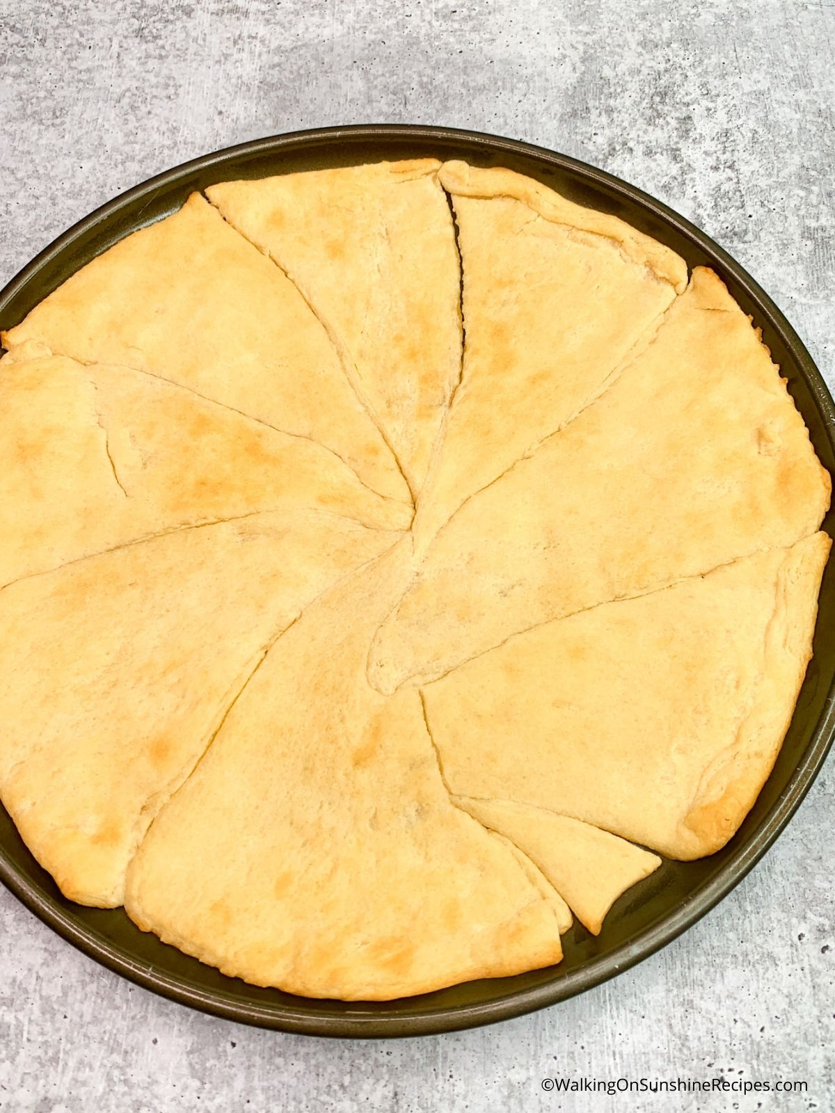 Baked crescent roll pizza crust.