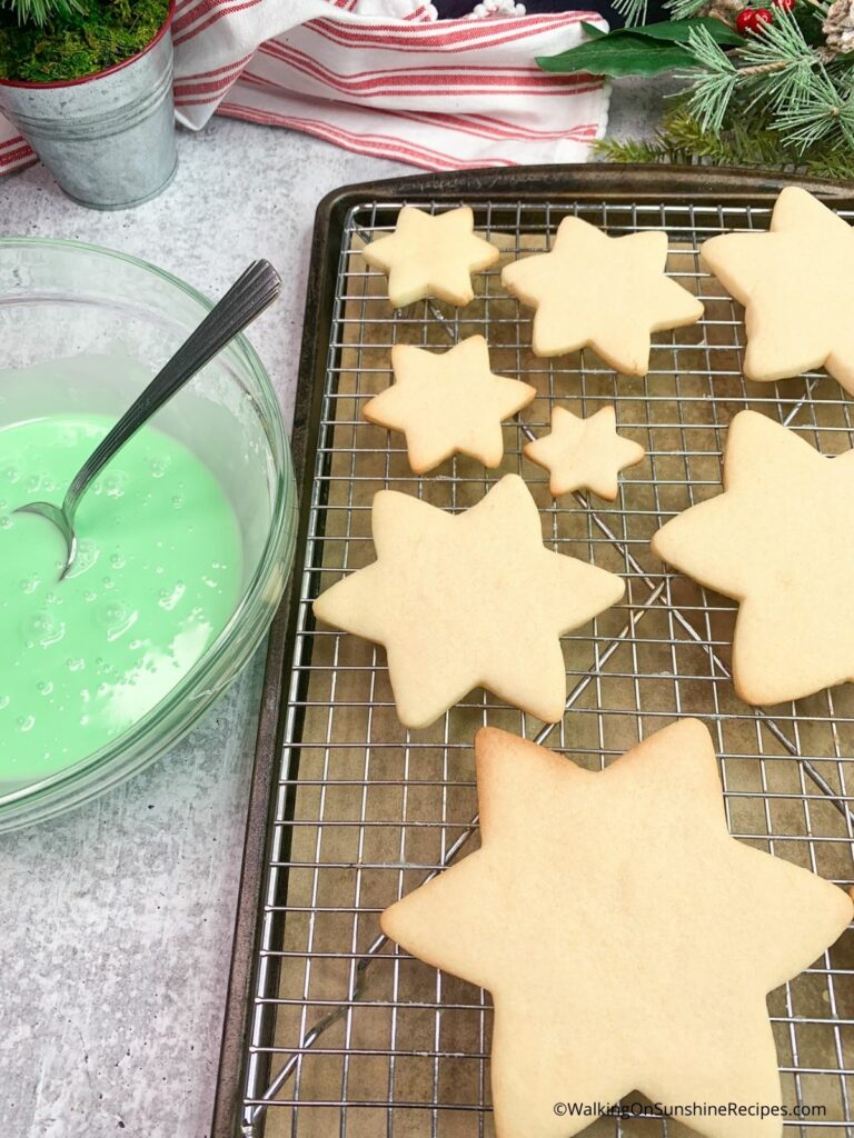 baked christmas cookies with green icing.