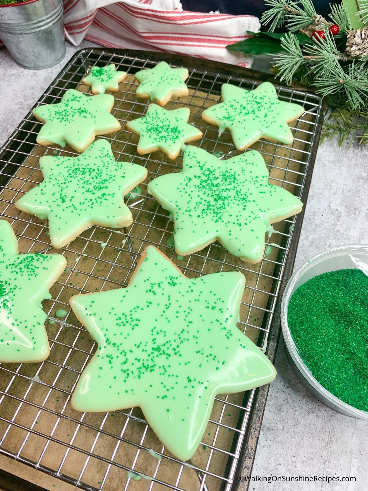 star shaped cookies dipped in green frosting.