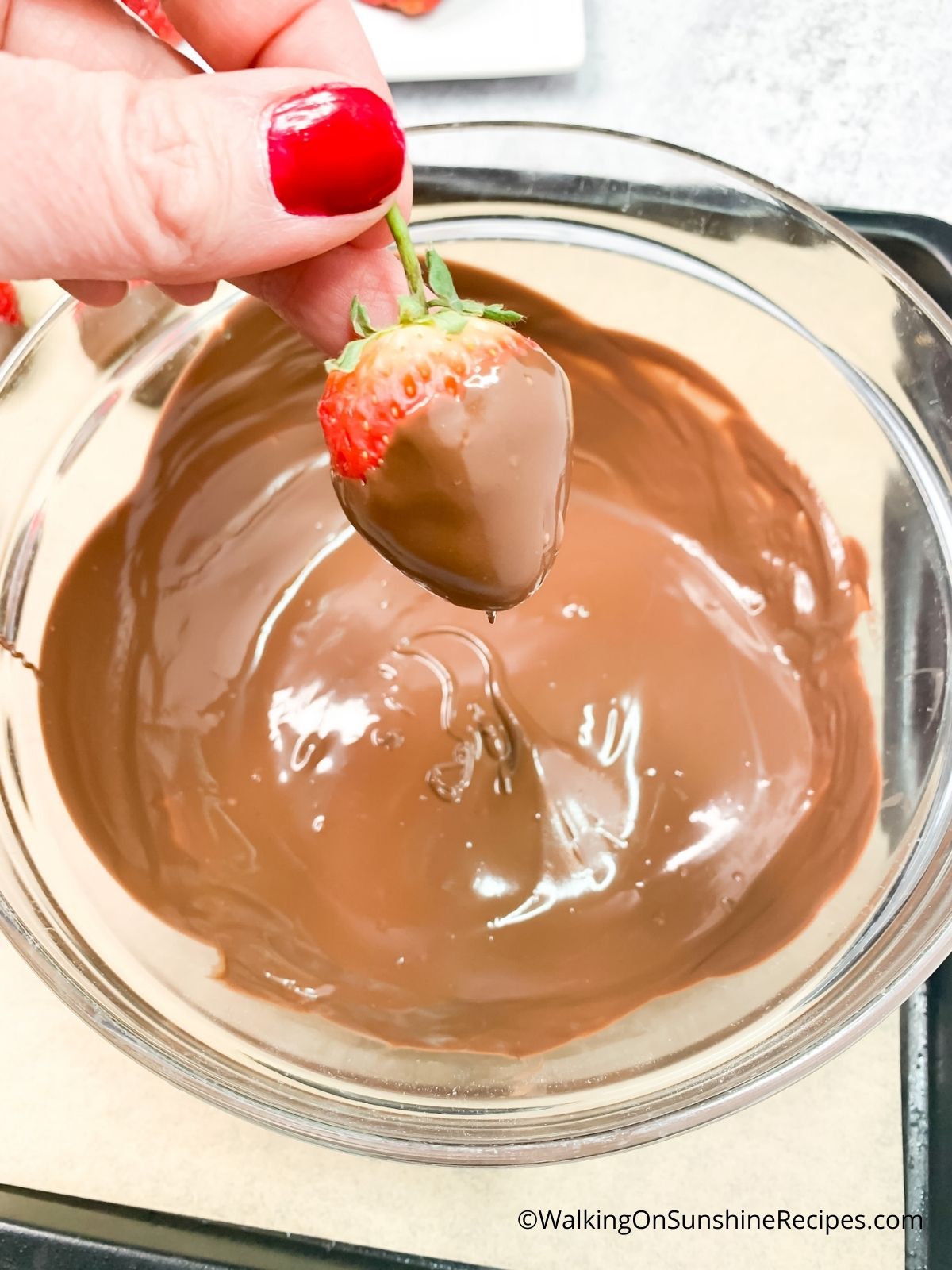 Dip strawberries in melted chocolate.