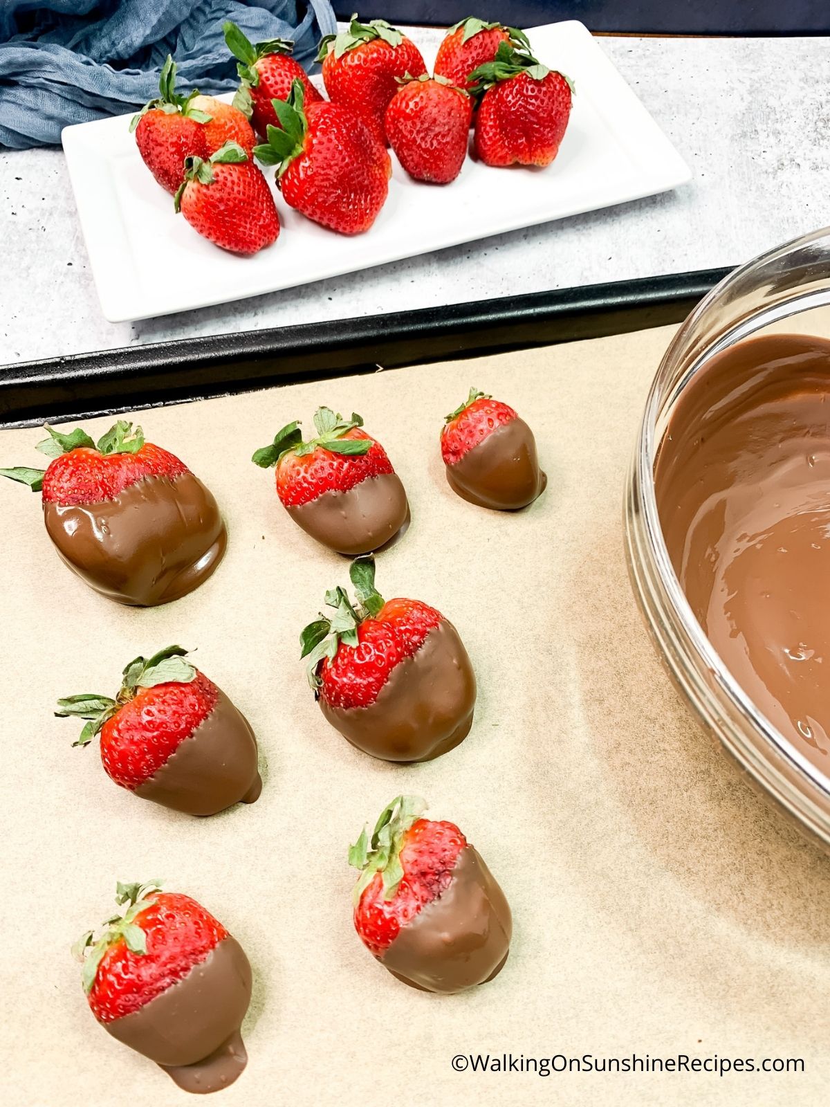 Let strawberries dry on parchment paper.