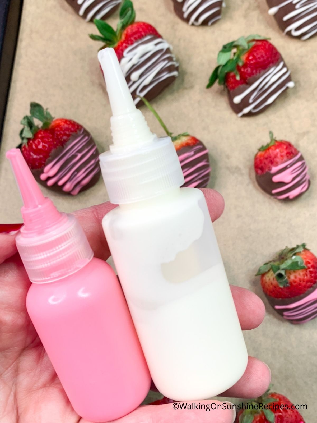White and Pink Melted Chocolate in Small drizzle bottles.