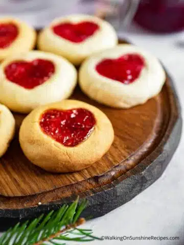 Baked Heart Shaped Valentine's Day Cookies on wooden tray.
