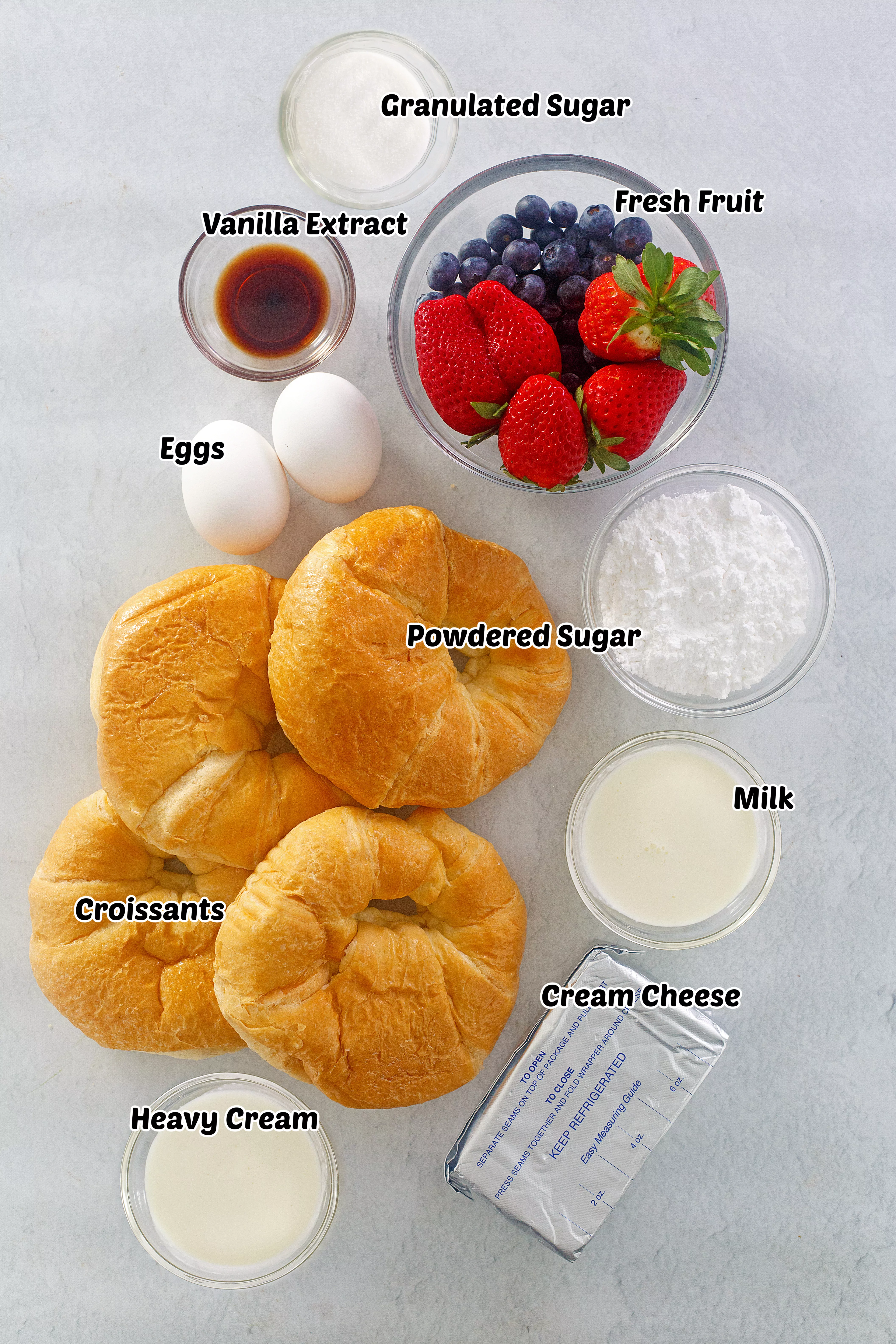 Ingredients for croissant breakfast casserole with fruit. 
