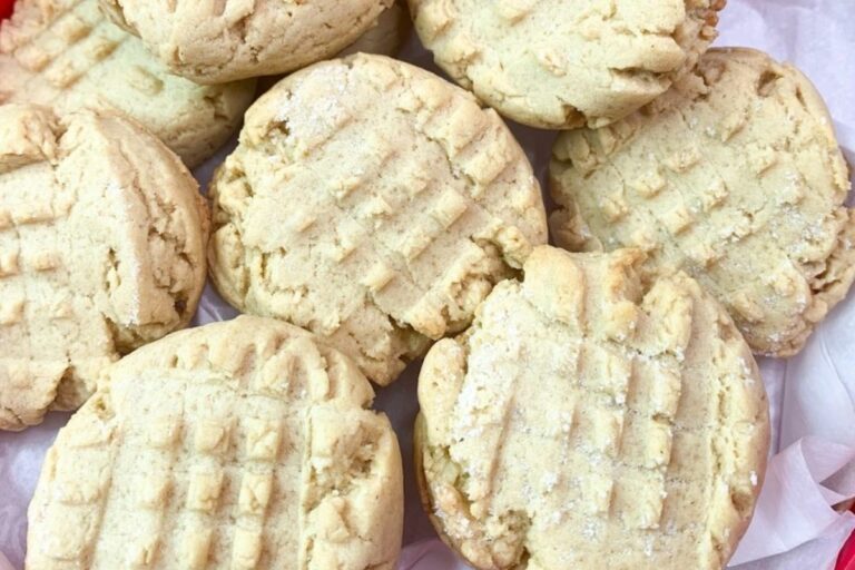 Shortbread cookies in a red bowl.