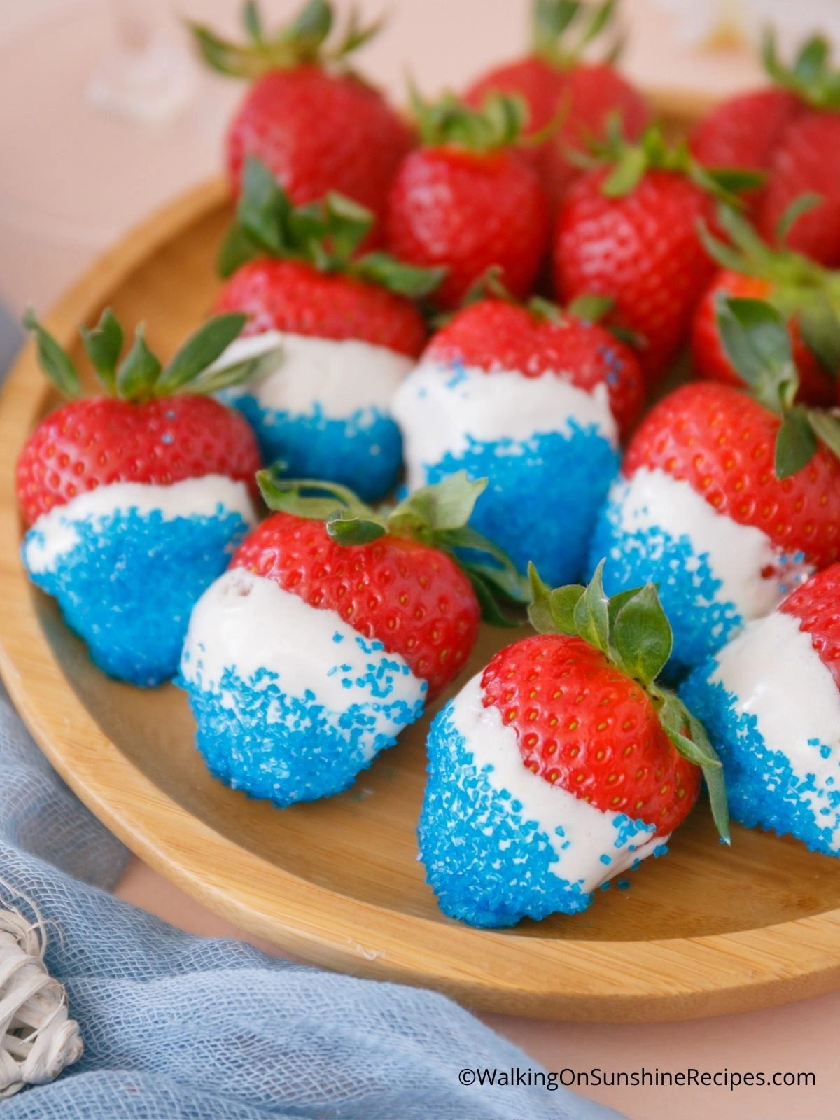 Patriotic strawberries  on wooden platter