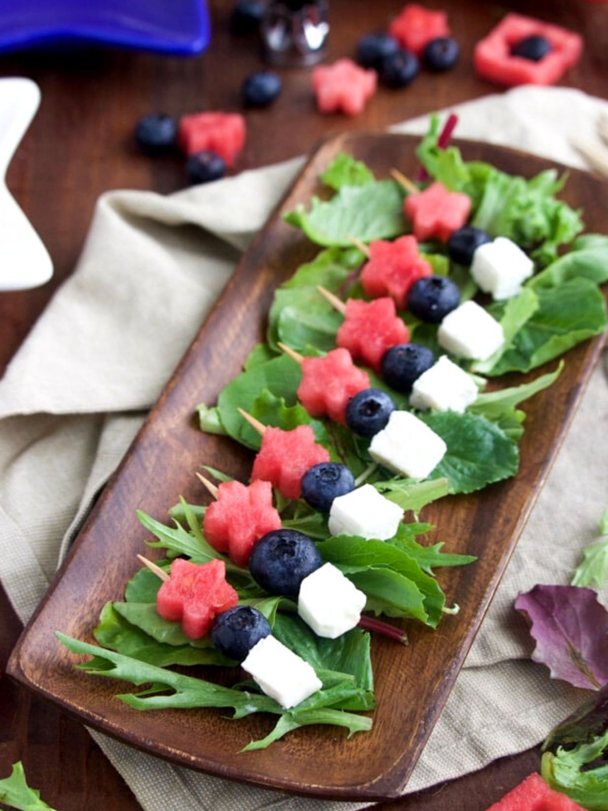 star shaped watermelon, blueberries and cheese on skewers. 