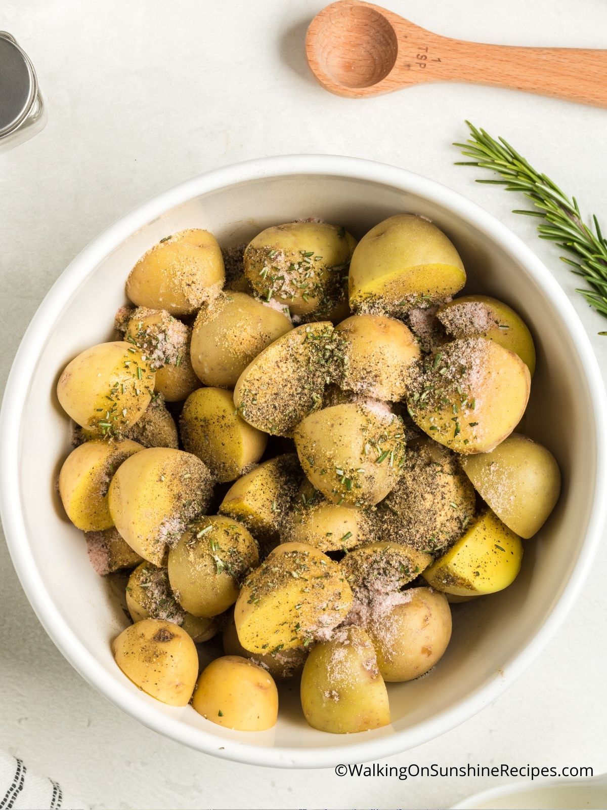 Add olive oil to potatoes.