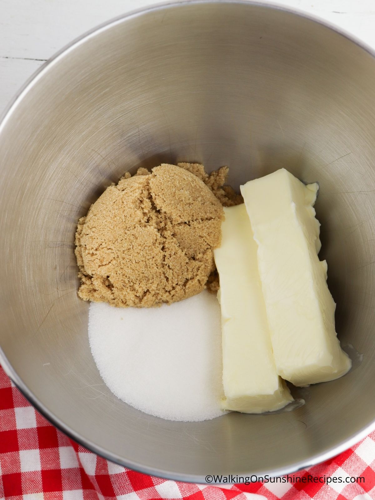 Cream butter with brown and white sugar.