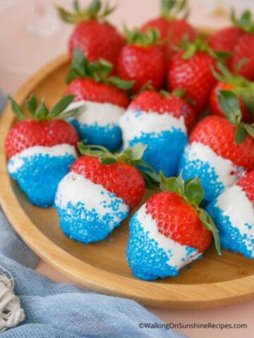 Patriotic strawberries on wooden platter