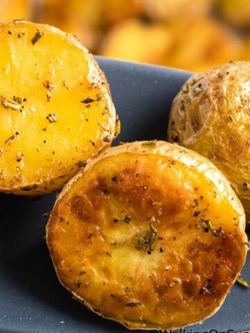 Roasted potatoes on a spatula.