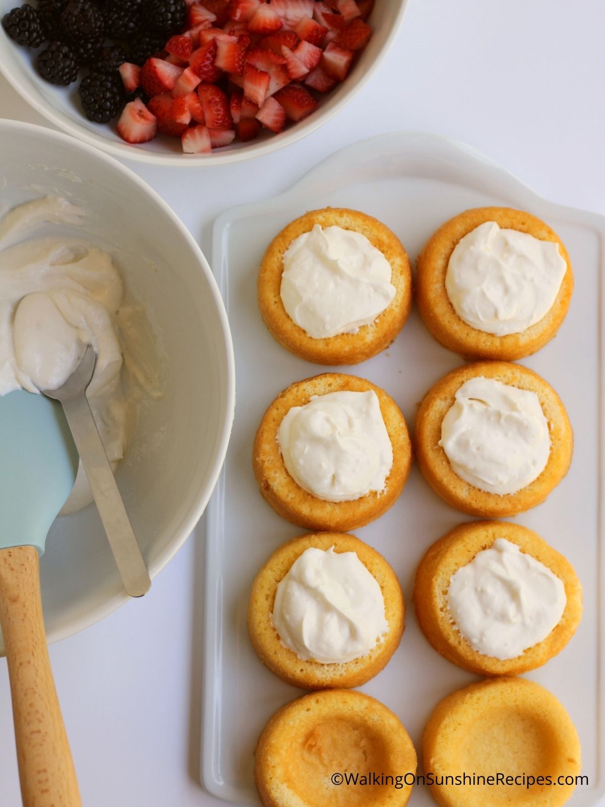 Fill dessert shells with cream cheese frostsing. 