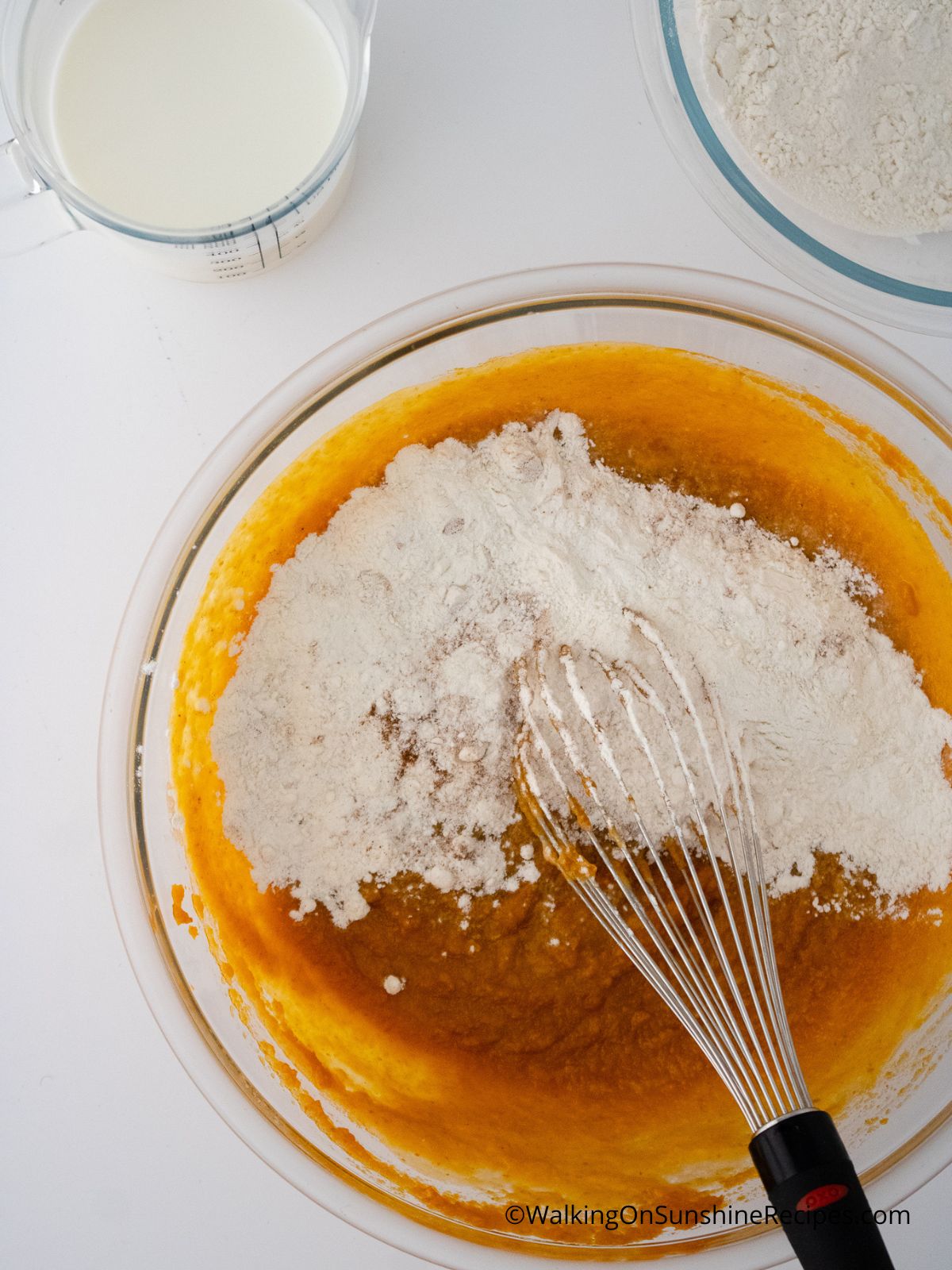 Mixing bowl of dry ingredients added to the wet ingredients