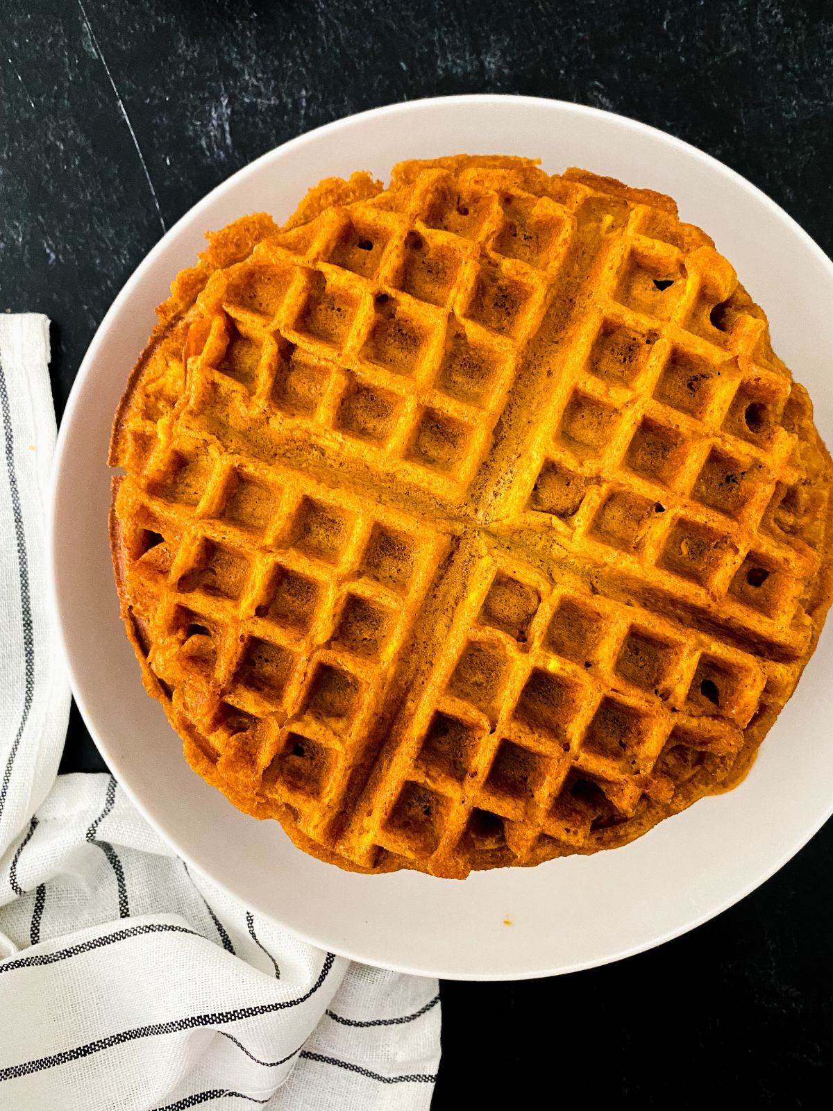 Pumpkin waffle on a white plate