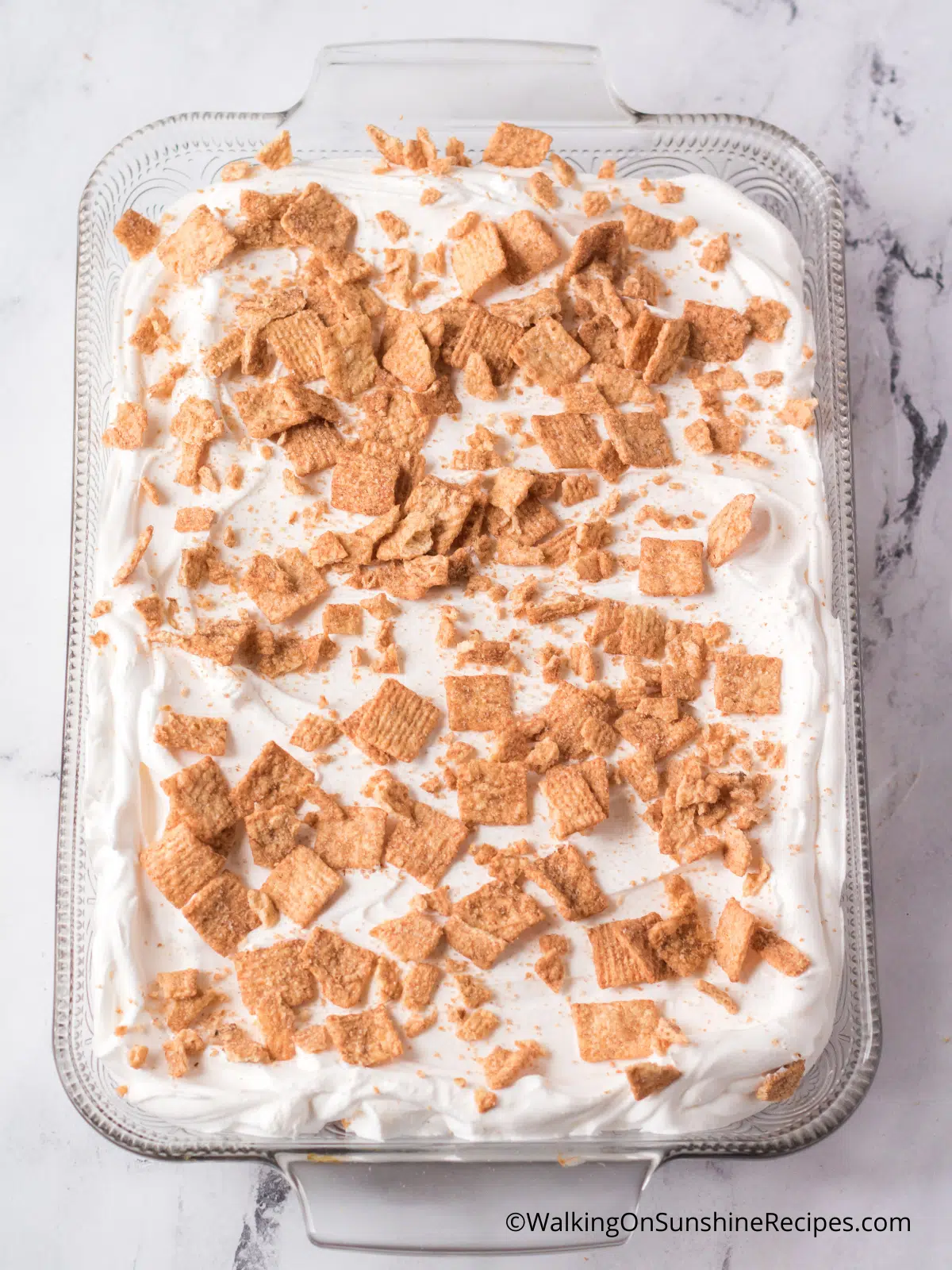 Cover with whipped topping and crushed cereal.