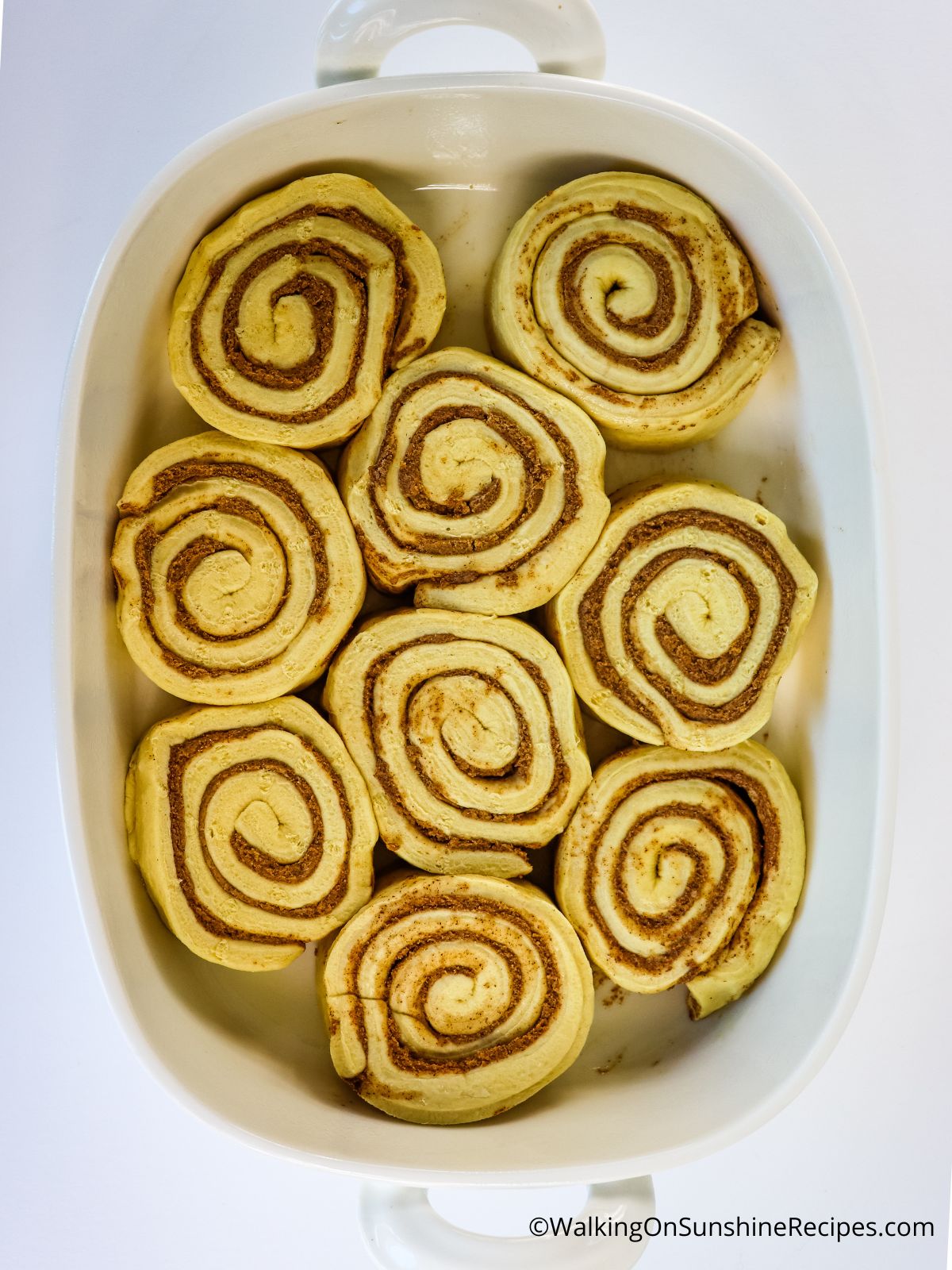 Cinnamon rolls in casserole dish.