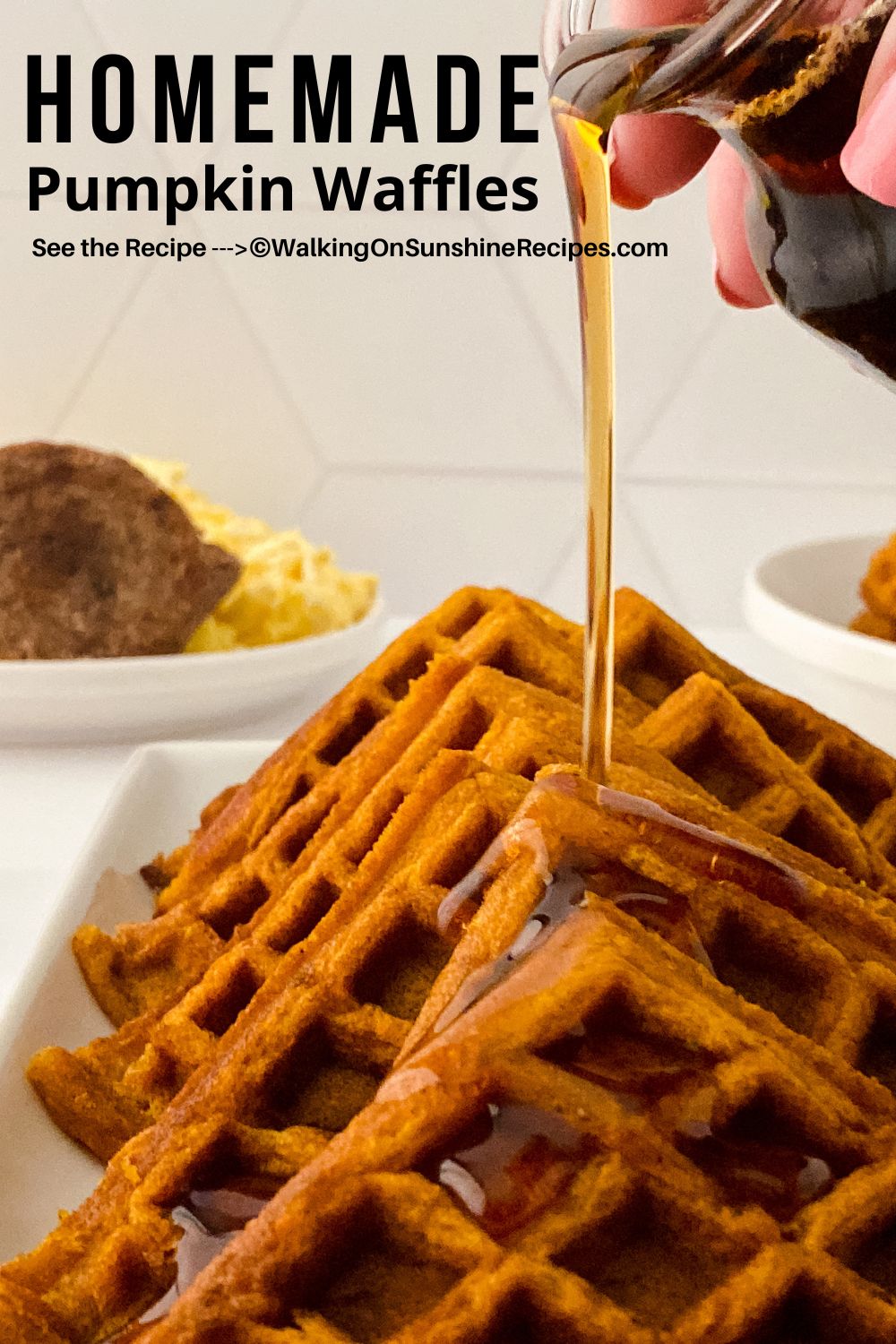 Syrup being poured onto a platter of homemade pumpkin waffles