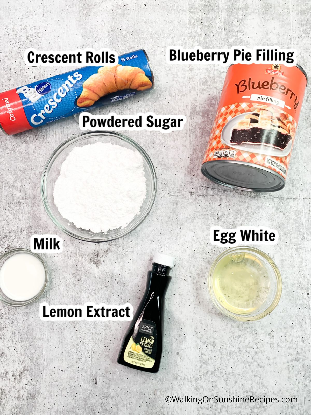 Ingredients - crescent rolls, blueberry pie filling, powdered sugar, egg white, milk, lemon extract.