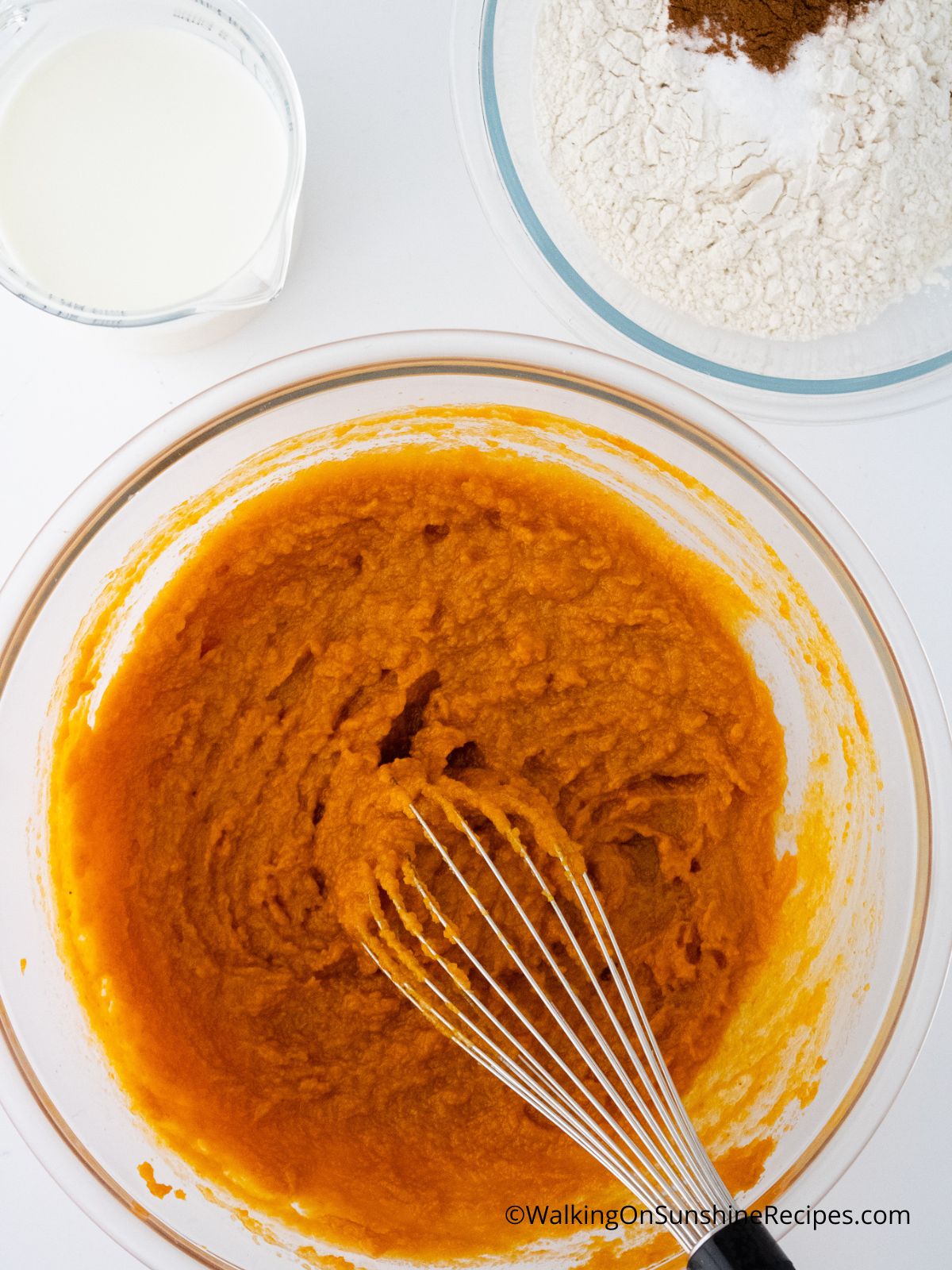 mixing bowl of pumpkin waffles wet ingredients