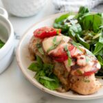 chicken breast with mozzarella tomato and basil.