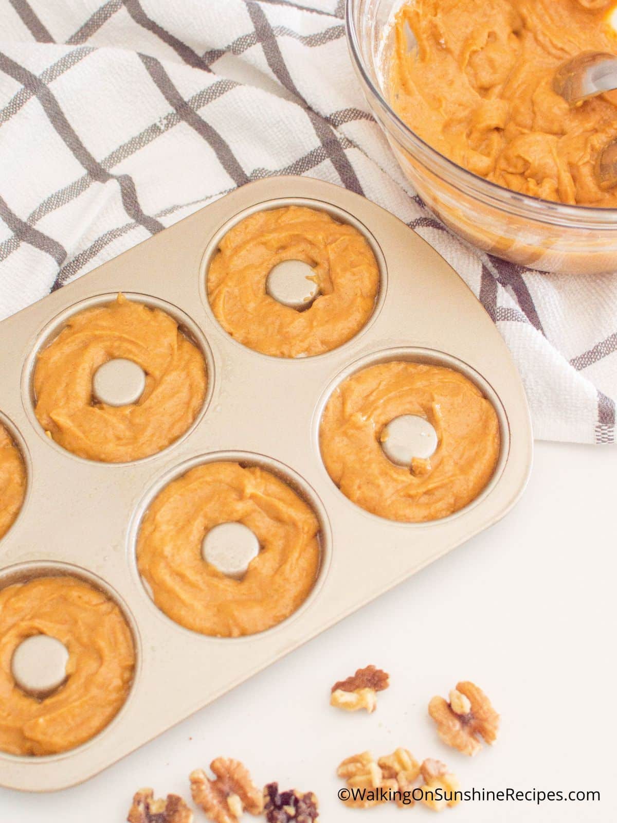 Fill the donut pan with the pumpkin donut batter.