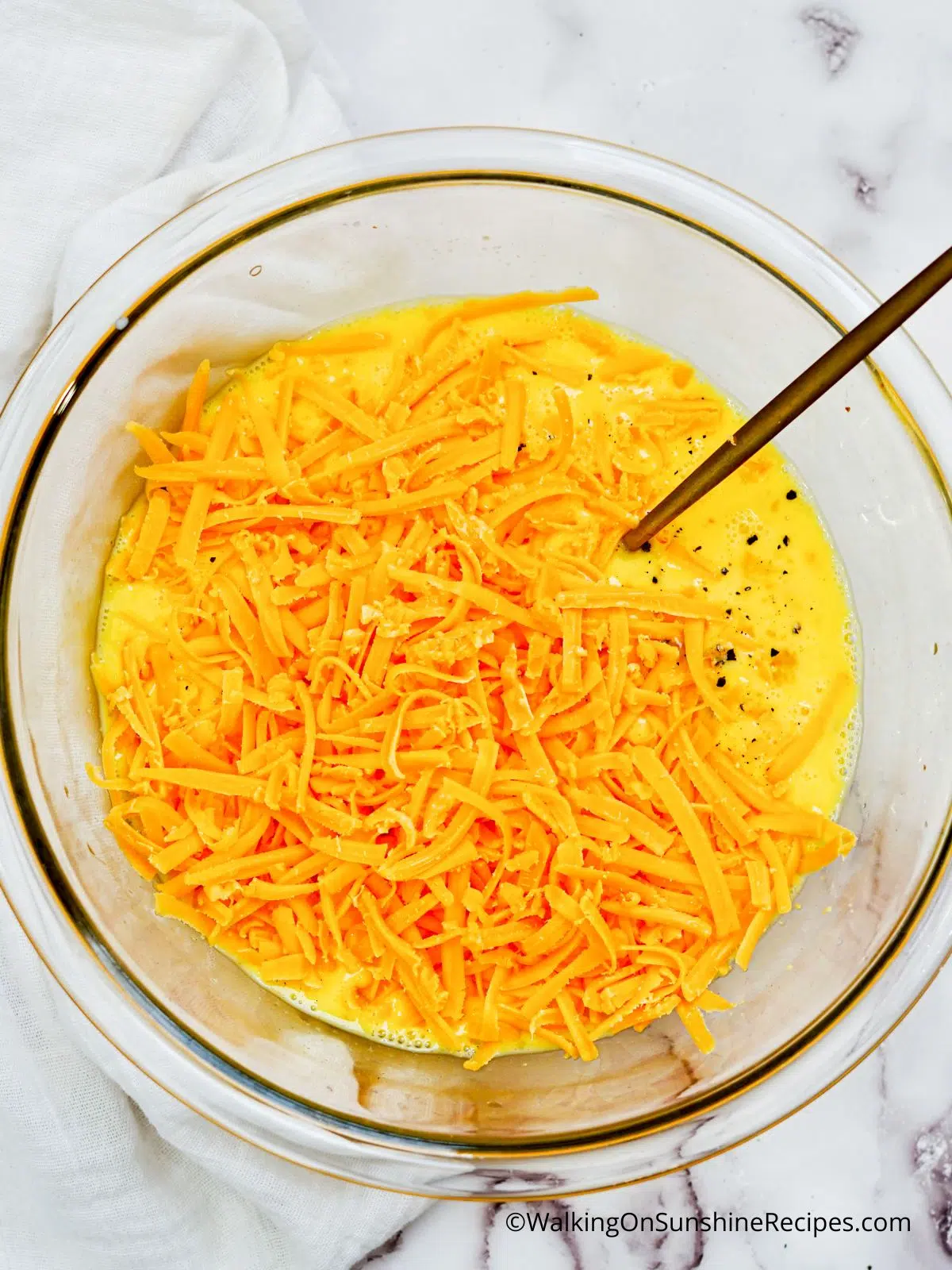 shredded cheddar cheese with egg mixture.