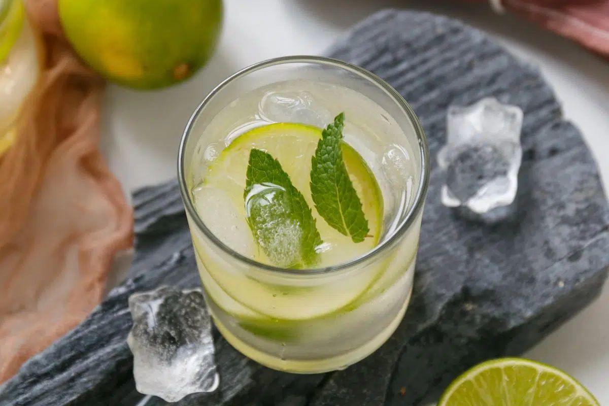 Refreshing lime-infused water with ice and lime slices.