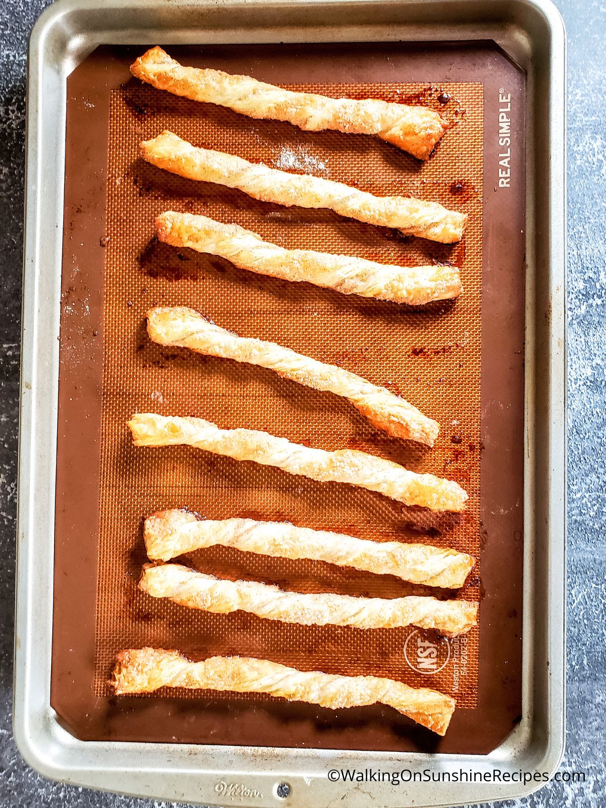 Puff Pastry Cinnamon Twists baked on baking tray.