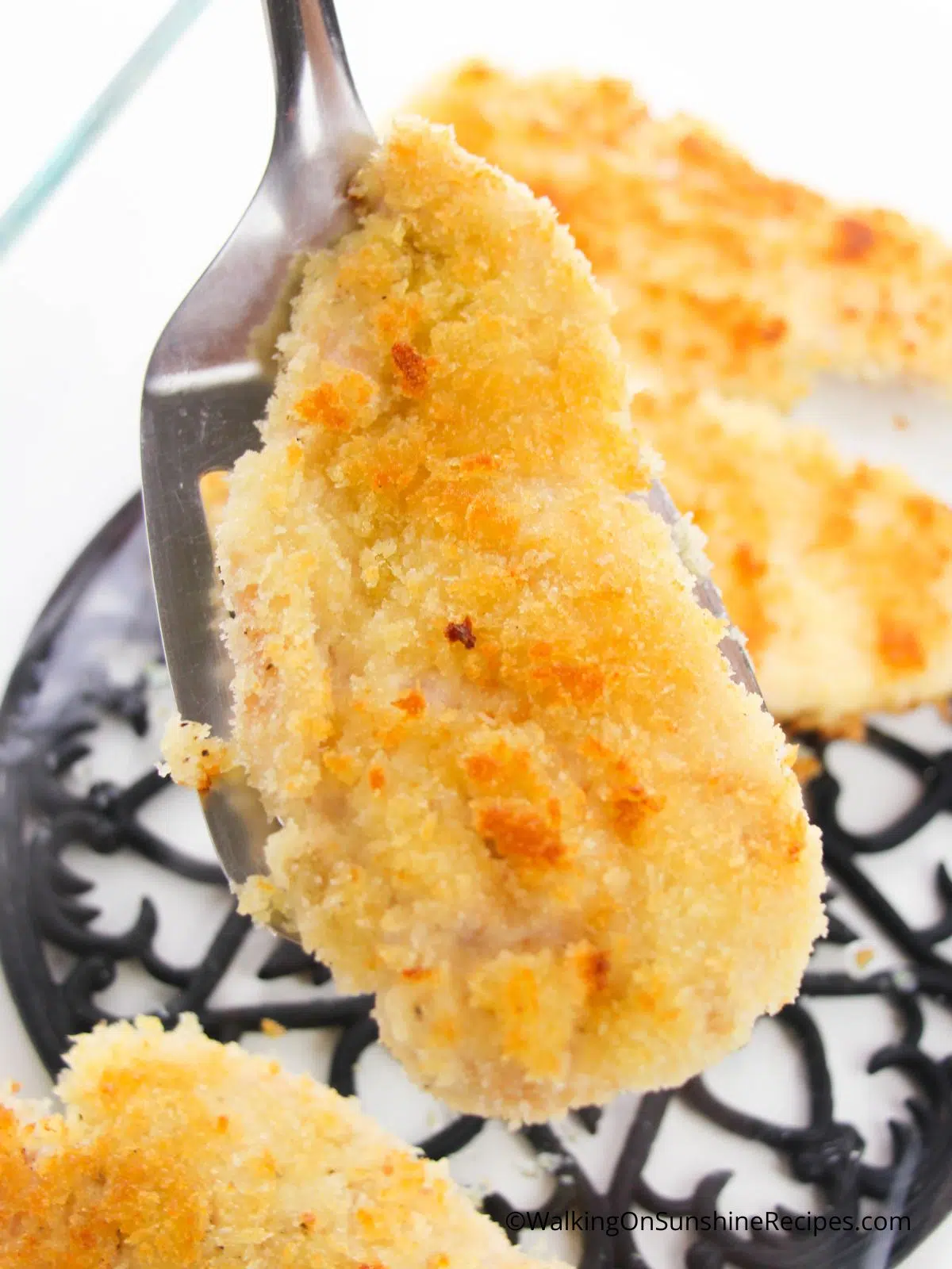 closeup of chicken with panko crumbs and mayonnaise.