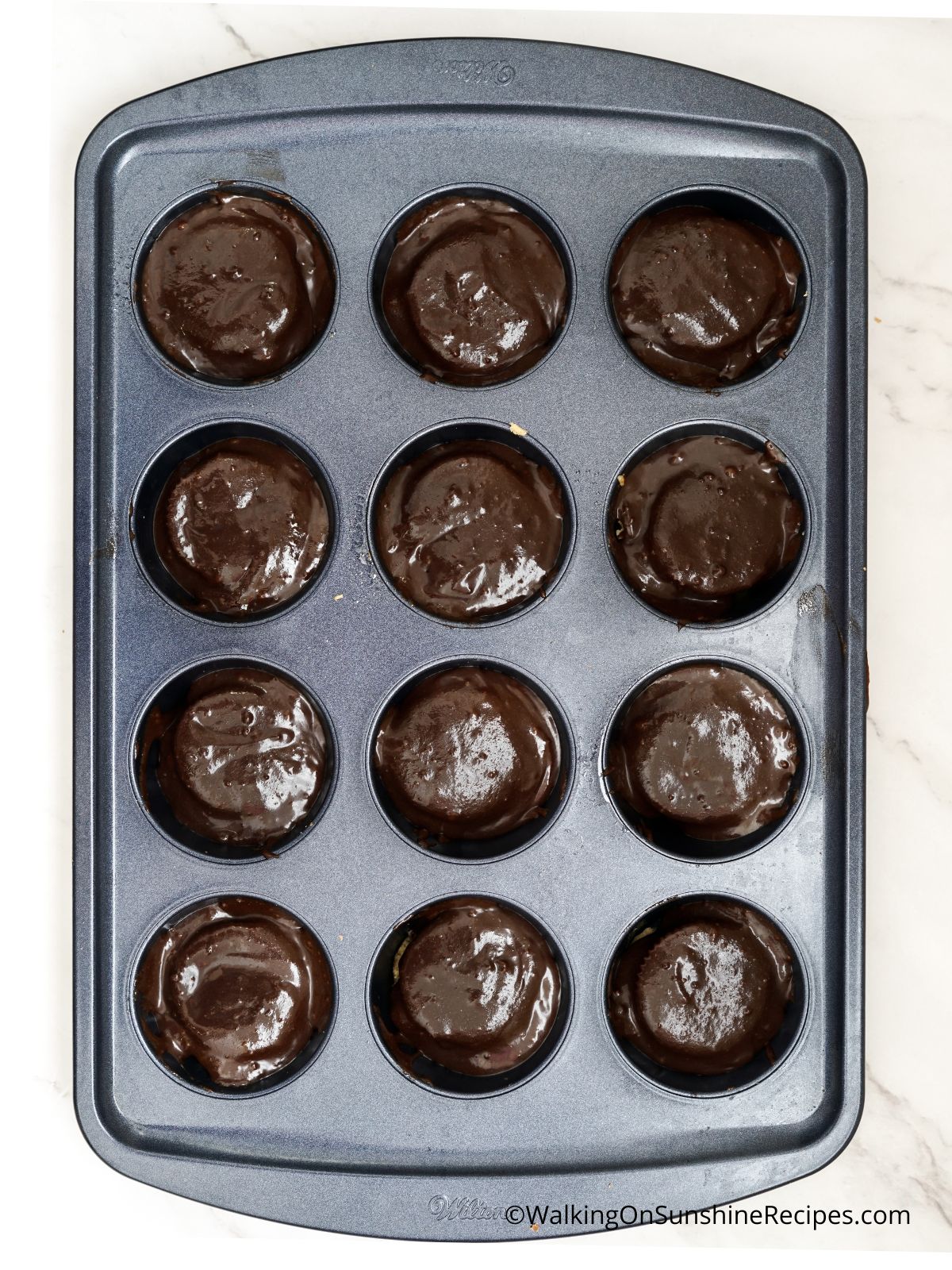 boxed brownie mix in muffin pan.
