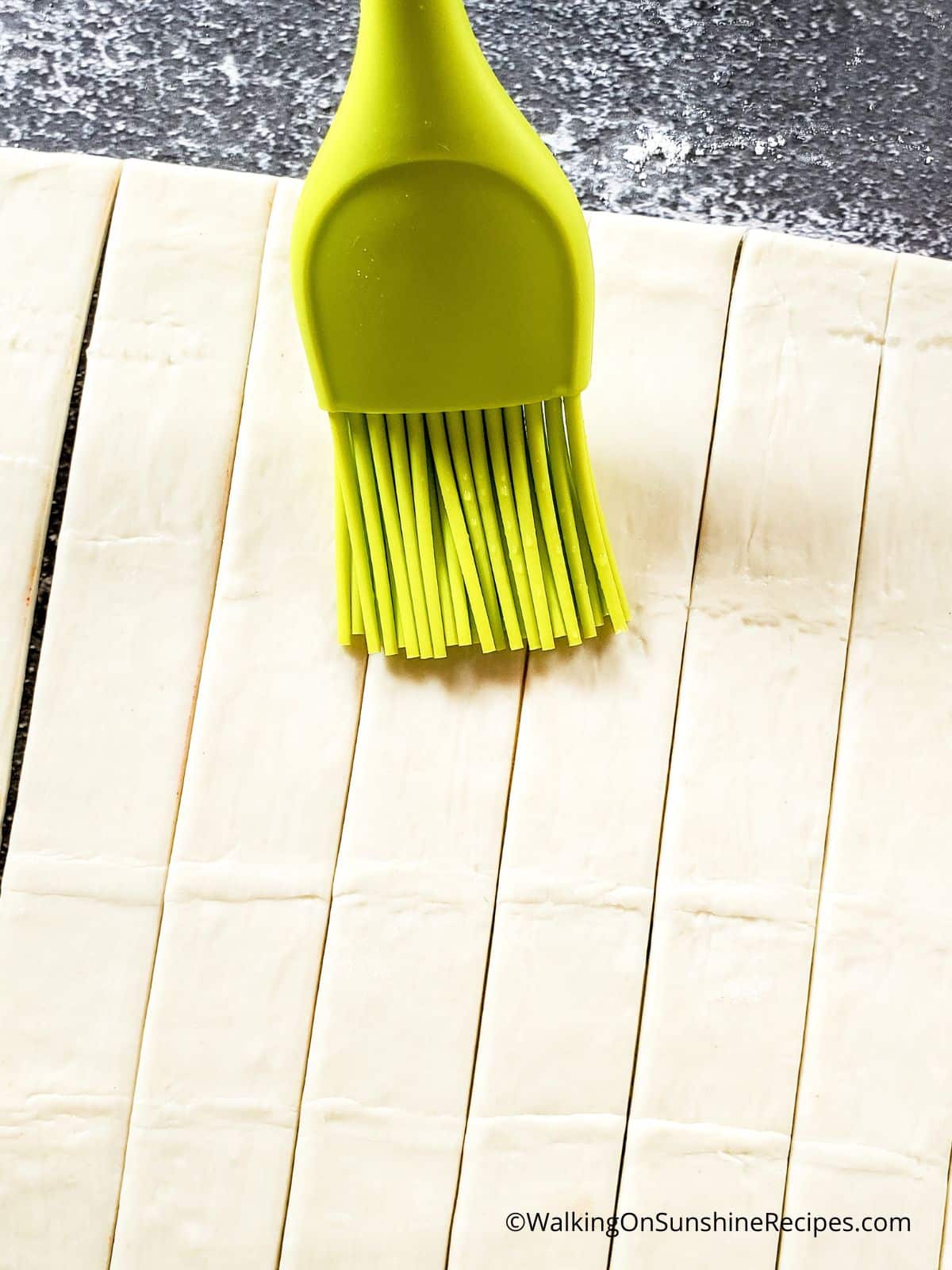 puff pastry strips with silicone basting brush.