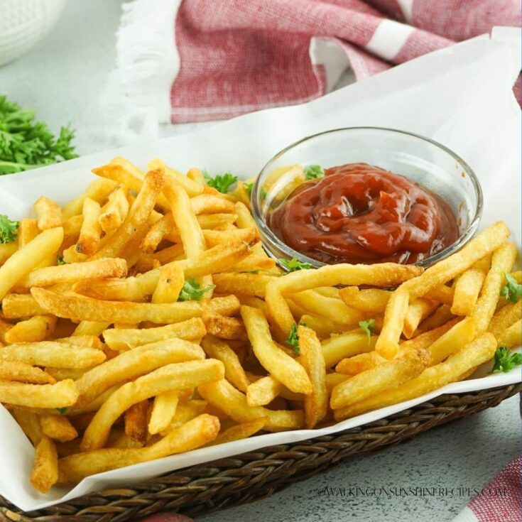 Crispy air fryer French Fries in basket.