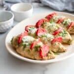 Hasselback Caprese Chicken with basil pesto.