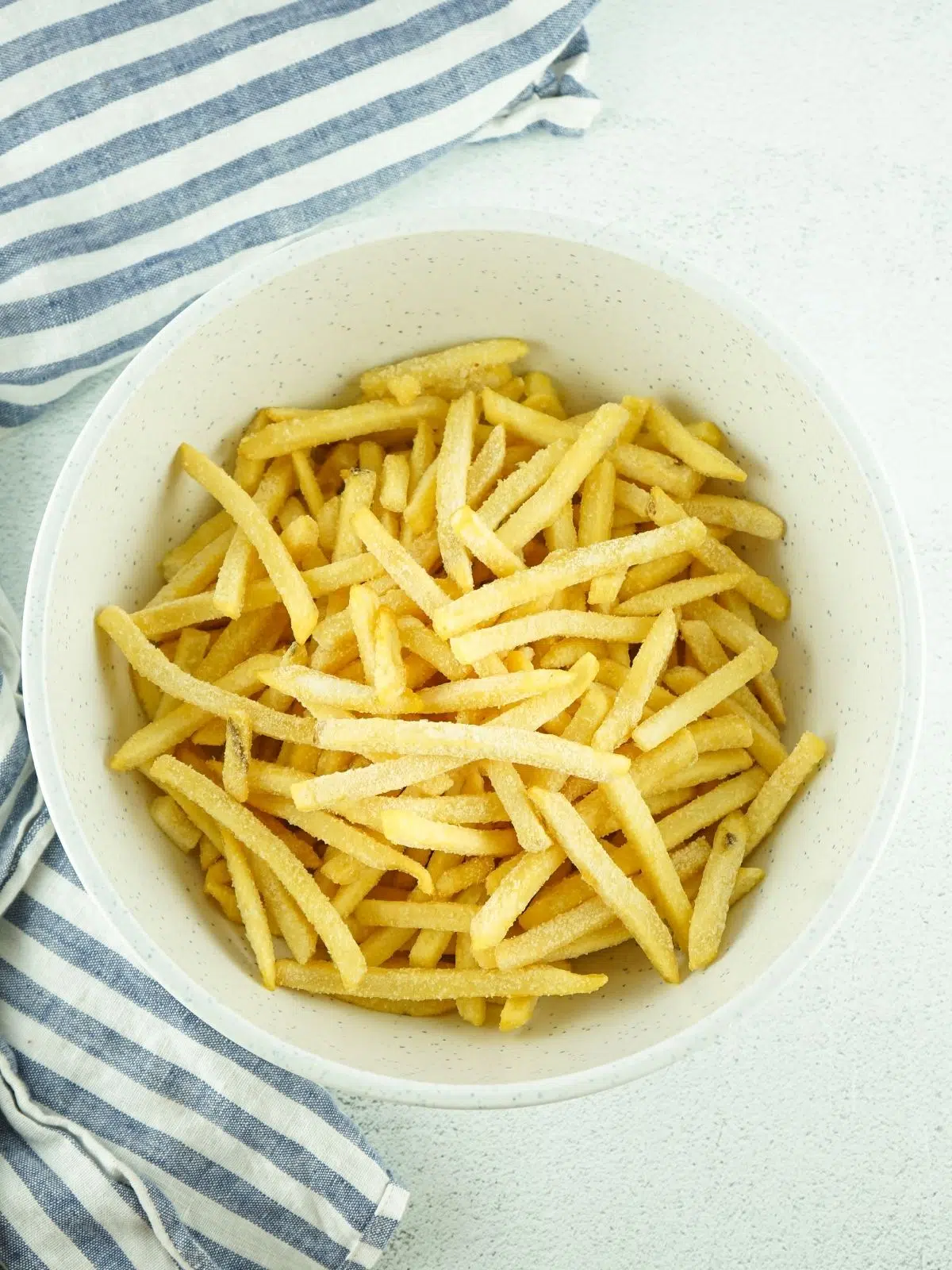 frozen French fries in bowl.
