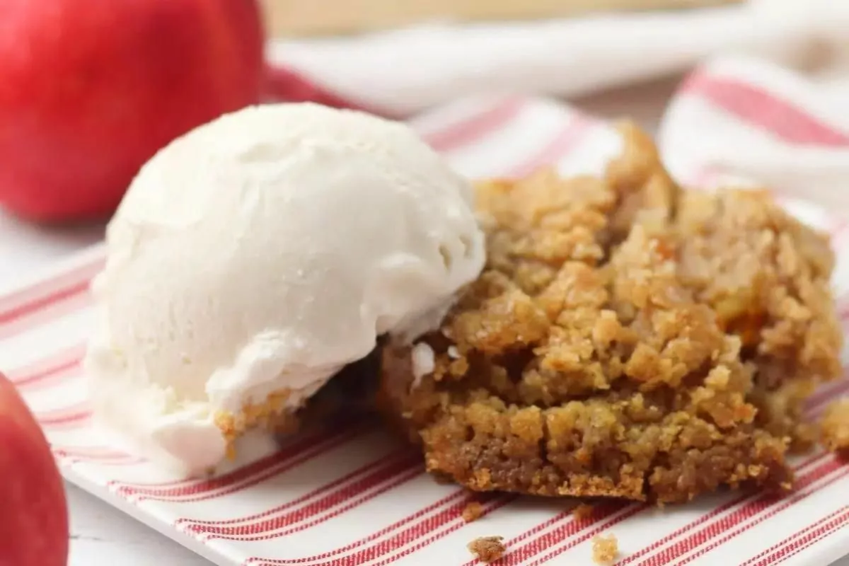 Pumpkin Apple Dump Cake with a scoop of vanilla ice cream