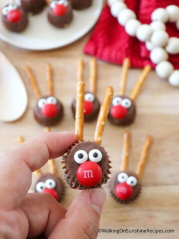 closeup of reindeer candy held in fingers.