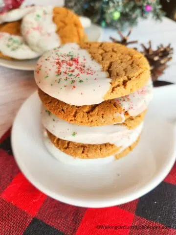 Stacked Gingerbread Cookies on white plate.