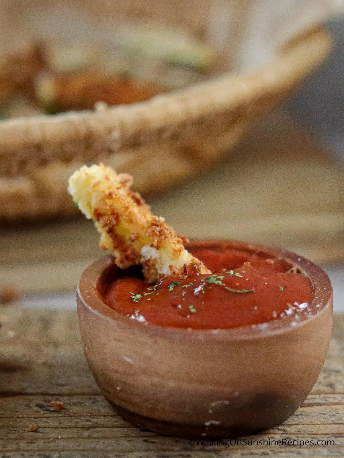 zucchini fry dipped in ketchup