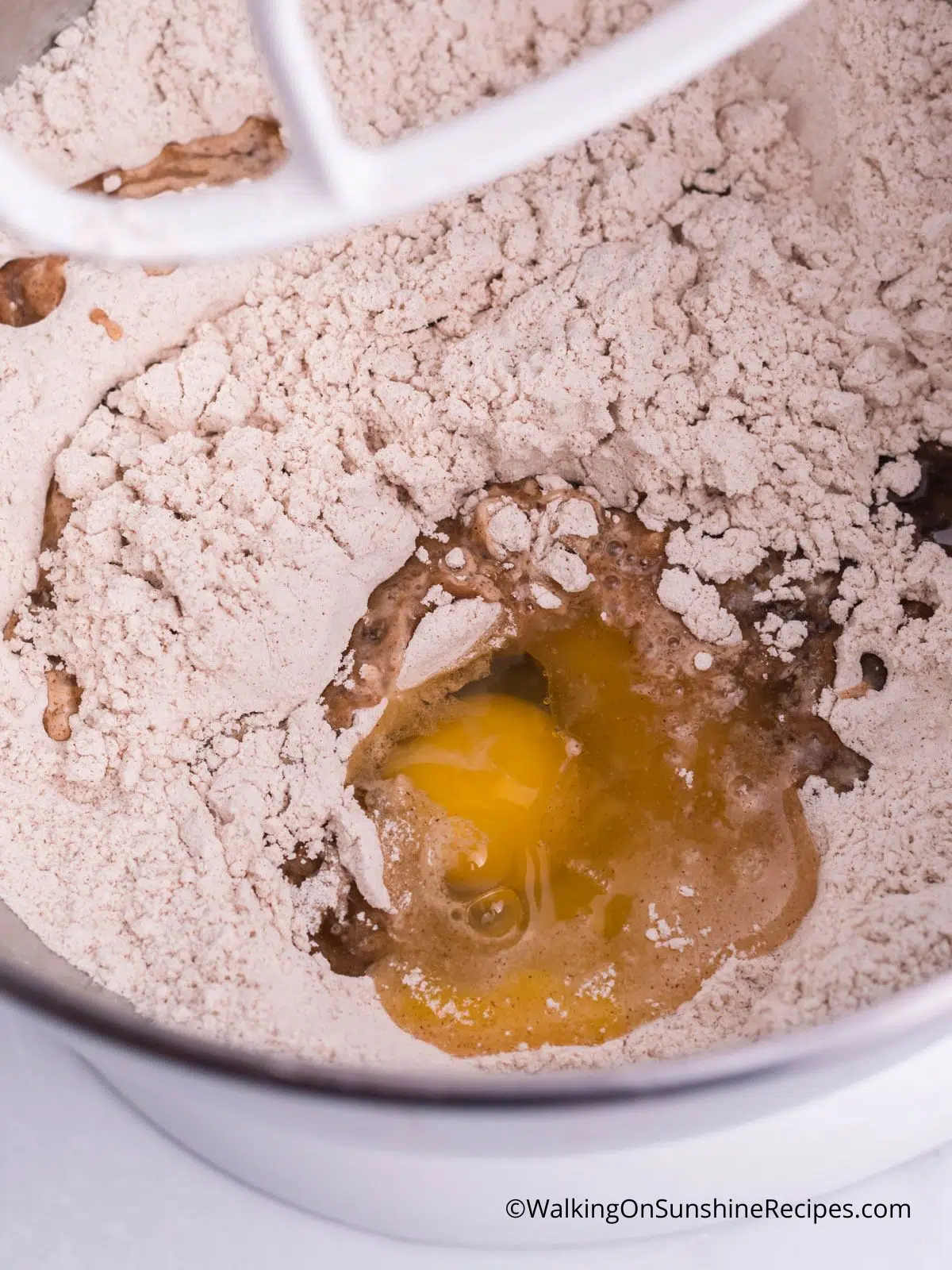 spice cake mix with eggs in mixing bowl.