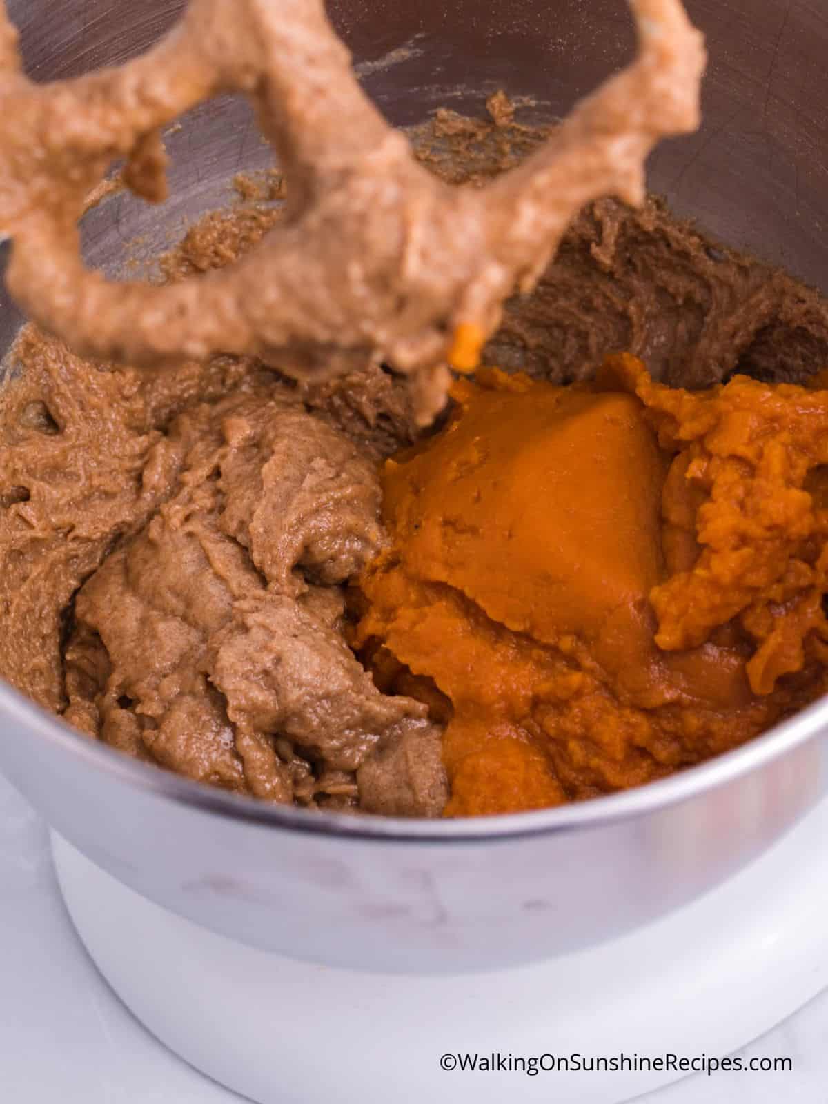 add canned pumpkin puree to spice cake mixture.