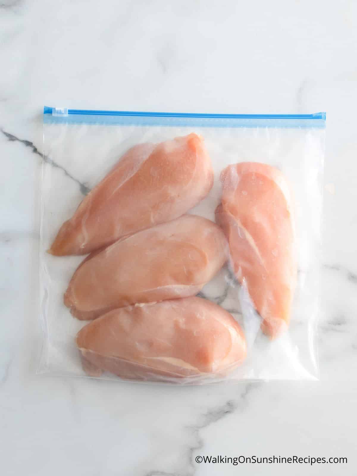 Add chicken cutlets to plastic bag for easy way to marinade or freeze chicken.