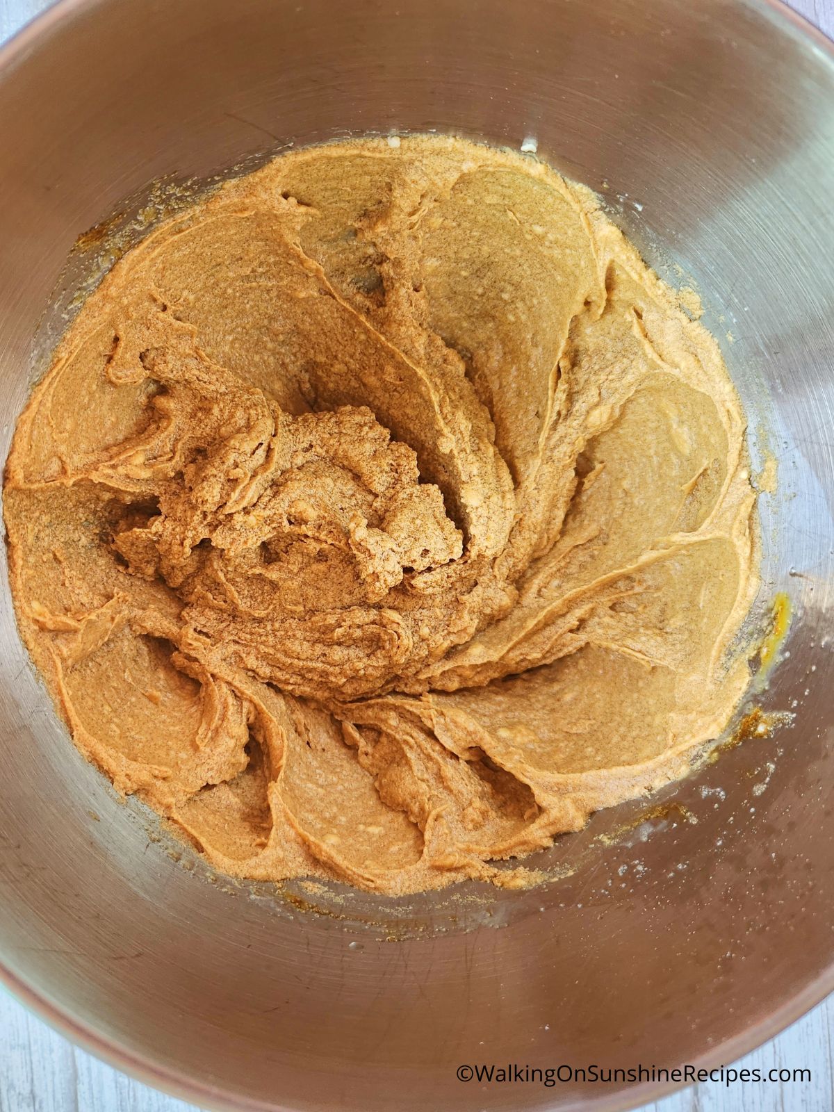 Butter and sugars combined together in mixing bowl.